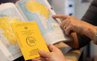 travel vaccine with a world map